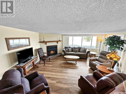 16 275 Alpine Crescent, Swift Current, SK - Indoor Photo Showing Living Room With Fireplace