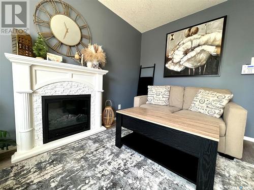 103 503 Colonel Otter Drive, Swift Current, SK - Indoor Photo Showing Living Room With Fireplace