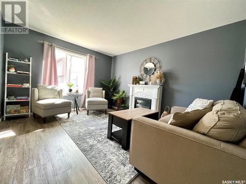 103 503 Colonel Otter Drive, Swift Current, SK - Indoor Photo Showing Living Room With Fireplace