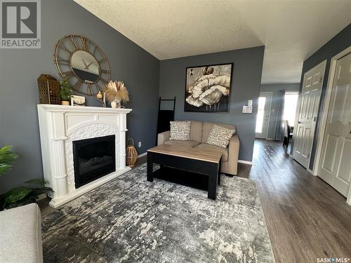 103 503 Colonel Otter Drive, Swift Current, SK - Indoor Photo Showing Living Room With Fireplace
