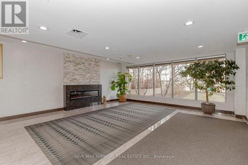 #211 -145 Hillcrest Ave, Mississauga, ON - Indoor Photo Showing Other Room With Fireplace