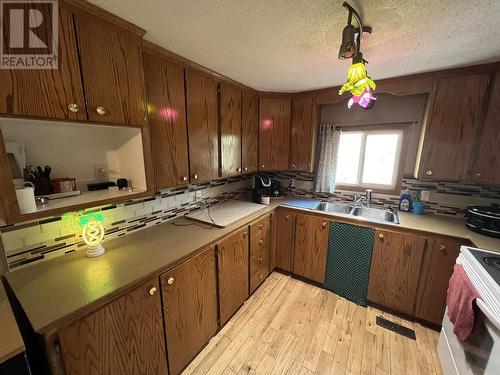5251 42 Street, Fort Nelson, BC - Indoor Photo Showing Kitchen With Double Sink