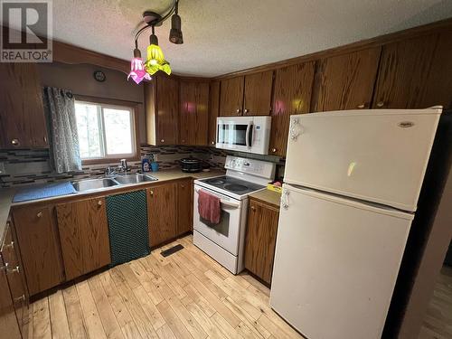 5251 42 Street, Fort Nelson, BC - Indoor Photo Showing Kitchen With Double Sink