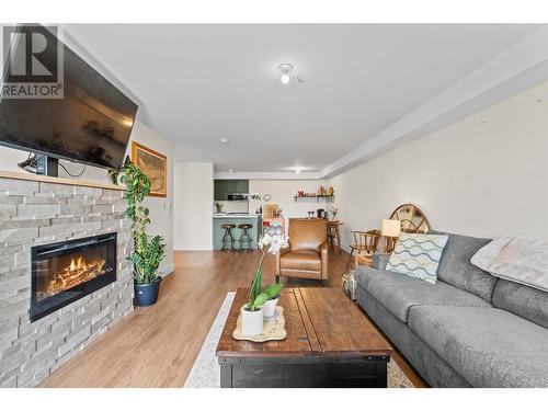 217 Elm Avenue Unit# 203, Penticton, BC - Indoor Photo Showing Living Room With Fireplace