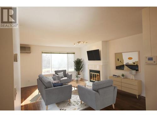 320 Brandon Avenue Unit# 107, Penticton, BC - Indoor Photo Showing Living Room With Fireplace