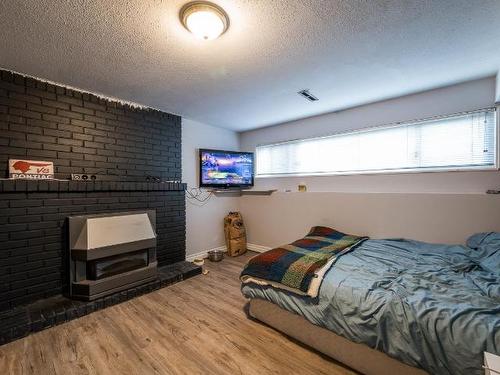 821 Schubert Drive, Kamloops, BC - Indoor Photo Showing Bedroom With Fireplace