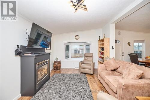 #441 -23 Four Mile Creek Rd, Niagara-On-The-Lake, ON - Indoor Photo Showing Living Room With Fireplace