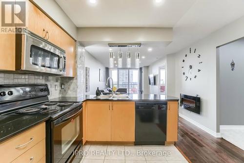 #708 -4090 Living Arts Dr, Mississauga, ON - Indoor Photo Showing Kitchen With Double Sink