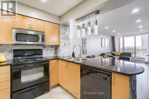 #708 -4090 Living Arts Dr, Mississauga, ON - Indoor Photo Showing Kitchen With Double Sink