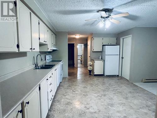 #203 -74 The Queensway S Rd, Georgina, ON - Indoor Photo Showing Kitchen With Double Sink