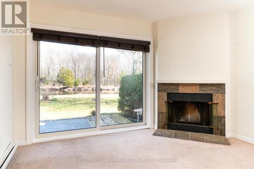 5 - 41 Laguna Parkway, Ramara, ON - Indoor Photo Showing Living Room With Fireplace
