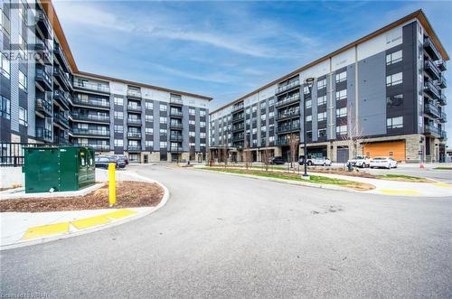 Building 255 on right side - 255 Northfield Drive Unit# 604, Waterloo, ON - Outdoor With Balcony With Facade