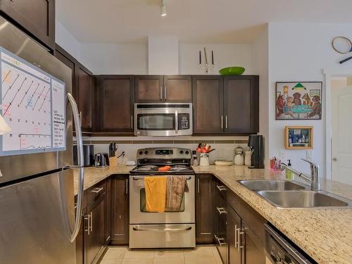 216-1350 Ridgeway Drive, Kelowna, BC - Indoor Photo Showing Kitchen With Double Sink