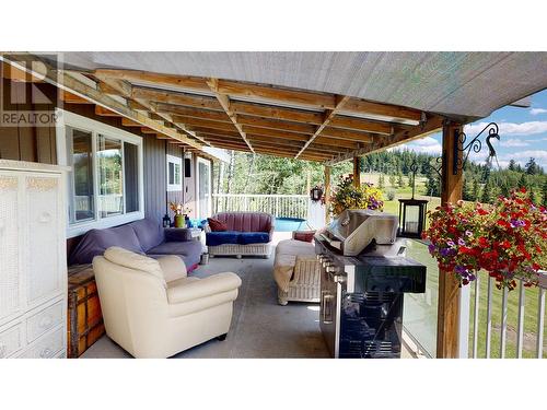 7796 N Bridge Lake Road, 100 Mile House, BC - Outdoor With Deck Patio Veranda With Exterior
