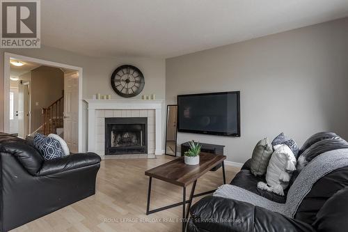 #48 -2470 Headon Forest Dr, Burlington, ON - Indoor Photo Showing Living Room With Fireplace