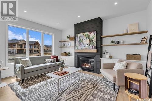 174 Keith Way, Saskatoon, SK - Indoor Photo Showing Living Room With Fireplace