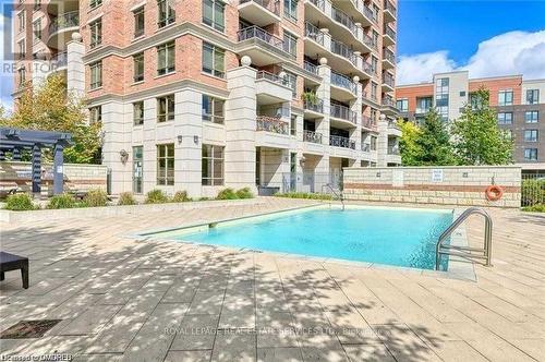 1104 - 2379 Central Park Drive, Oakville, ON - Outdoor With In Ground Pool With Balcony With Facade