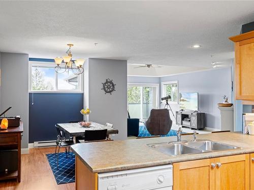 11-340 Young St, Parksville, BC - Indoor Photo Showing Dining Room With Fireplace