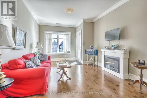 #208 -80 Burns Blvd, King, ON - Indoor Photo Showing Living Room With Fireplace