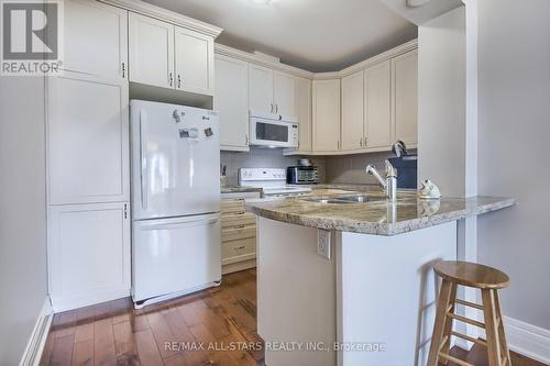 #208 -80 Burns Blvd, King, ON - Indoor Photo Showing Kitchen With Double Sink