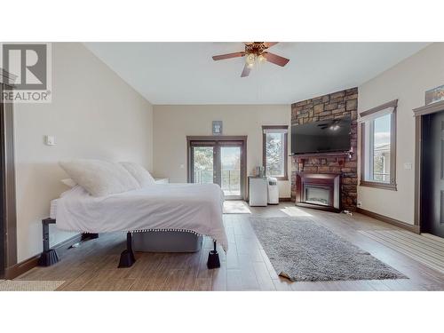 1370 Bullmoose Way Lot# 21, Osoyoos, BC - Indoor Photo Showing Bedroom With Fireplace