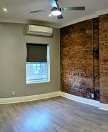 Pimary Bedroom with exposed brick - 