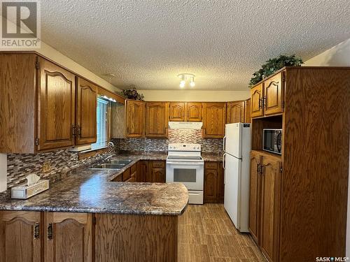 25 Swain Crescent, Humboldt, SK - Indoor Photo Showing Kitchen With Double Sink