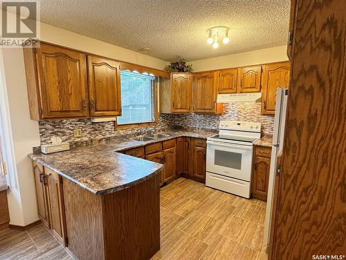 25 Swain Crescent, Humboldt, SK - Indoor Photo Showing Kitchen With Double Sink