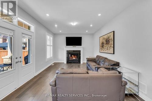 3298 Charles Fay Pass, Oakville, ON - Indoor Photo Showing Living Room With Fireplace