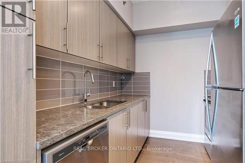 #205 -65 Speers Rd, Oakville, ON - Indoor Photo Showing Kitchen With Stainless Steel Kitchen With Double Sink