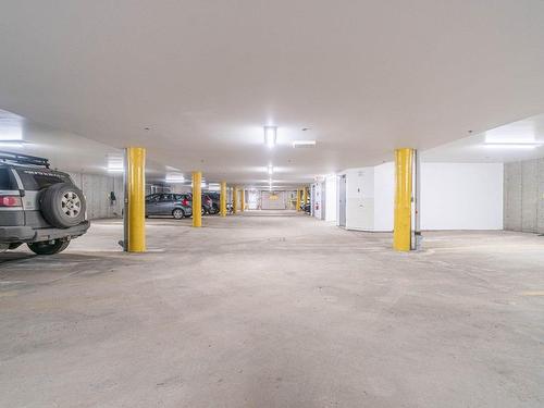 Garage - 201-145 Rue Du Ruisseau-Clair, Mont-Tremblant, QC - Indoor Photo Showing Garage