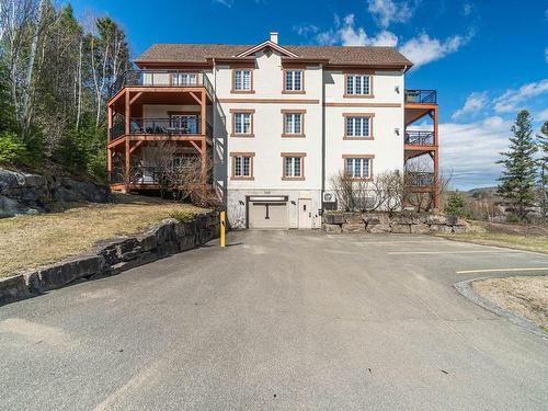 Garage - 201-145 Rue Du Ruisseau-Clair, Mont-Tremblant, QC - Outdoor With Balcony