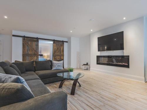 Family room - 45 Rue Mayfair, Hudson, QC - Indoor Photo Showing Living Room With Fireplace