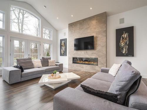 Living room - 45 Rue Mayfair, Hudson, QC - Indoor Photo Showing Living Room With Fireplace