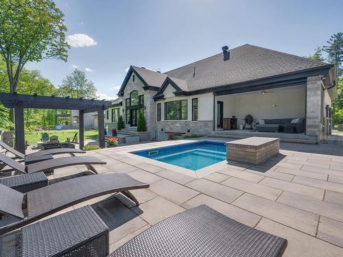 Face arriÃ¨re - 45 Rue Mayfair, Hudson, QC - Outdoor With In Ground Pool With Exterior