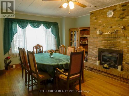 12613 Furnival Rd, West Elgin, ON - Indoor Photo Showing Dining Room With Fireplace