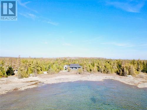 Set on the crystal clear shores of Lake Huron. - 34 Hatt Street, Northern Bruce Peninsula, ON - Outdoor With Body Of Water With View