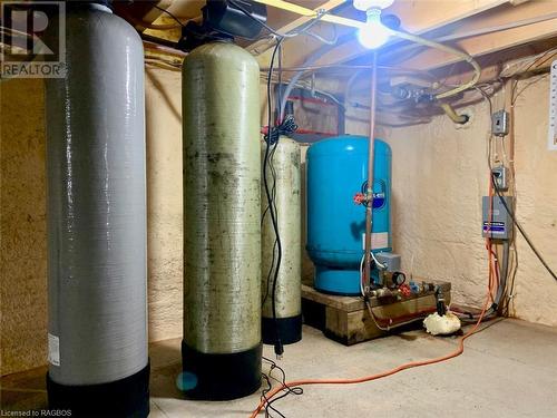 Excellent water supply system including drilled well with deep well pump, UV system, particle filter, iron  filter & water softener ensures great water. - 34 Hatt Street, Northern Bruce Peninsula, ON - Indoor Photo Showing Basement