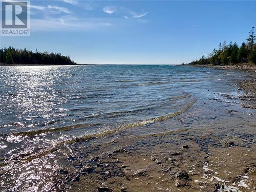 A gorgeous, protected inlet/bay with amazing west-facing open water Lake Huron views. - 34 Hatt Street, Northern Bruce Peninsula, ON - Outdoor With Body Of Water With View