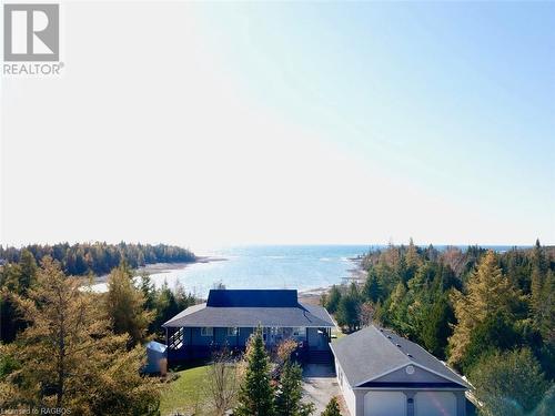 3/4 of an acre property is 'cut' into the cedars, offering year-round privacy from neighouring properties. - 34 Hatt Street, Northern Bruce Peninsula, ON - Outdoor With View