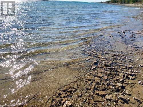 Solid limestone rock bottom right into the water. - 34 Hatt Street, Northern Bruce Peninsula, ON - Outdoor With Body Of Water With View