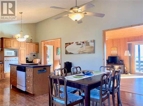 Dining & kitchen areas offer vaulted ceilings & water views & open access to the Great Room. - 34 Hatt Street, Northern Bruce Peninsula, ON - Indoor