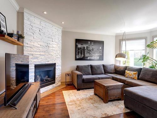Living room - 232 Rue De La Renaissance, Blainville, QC - Indoor Photo Showing Living Room With Fireplace
