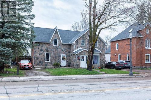 74 Queen St W, Springwater, ON - Outdoor With Facade