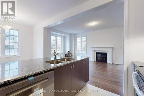 1564 Scarlett Tr S, Pickering, ON - Indoor Photo Showing Kitchen With Fireplace With Double Sink