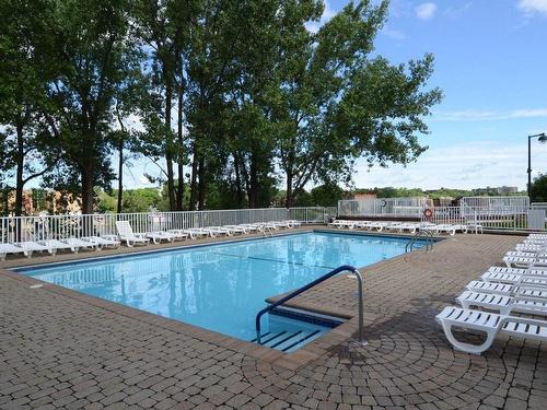 Pool - 904-500 Place Juge-Desnoyers, Laval (Pont-Viau), QC - Outdoor With In Ground Pool With Backyard