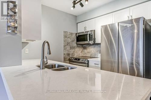 #112 -300 Ray Lawson Blvd, Brampton, ON - Indoor Photo Showing Kitchen With Double Sink With Upgraded Kitchen