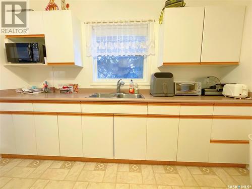 703 5Th Street, Humboldt, SK - Indoor Photo Showing Kitchen With Double Sink