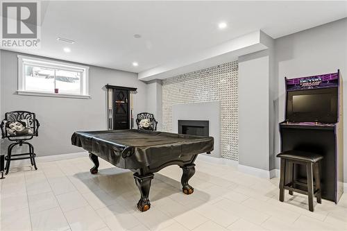 Gorgeous Rec Rm with in floor heating, linear gas fireplace - 165 Finsbury Avenue, Stittsville, ON - Indoor Photo Showing Other Room