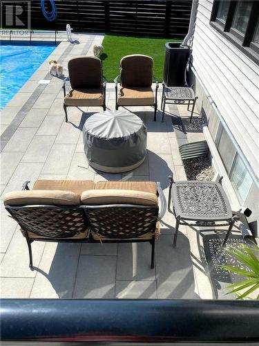 Rear yard shows outdoor sitting area - 165 Finsbury Avenue, Stittsville, ON - Outdoor With In Ground Pool